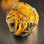 Tea Rose Chrysanthemum flowering tea – hand-tied tea ball opening into golden chrysanthemum