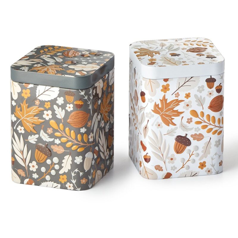 Hazel Autumn Tea Tin in dark grey and cream with embossed woodland designs featuring autumn leaves, hazelnuts and acorns